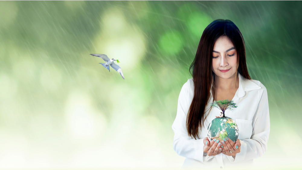 Asian woman holding a globe