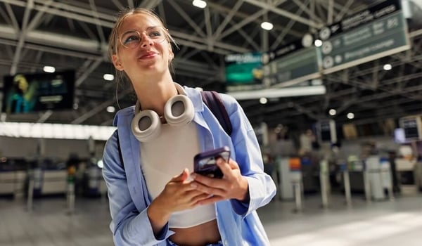 woman with headphones and phone