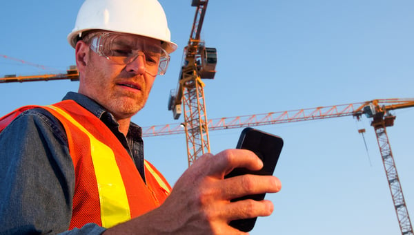 construction worker on his phone