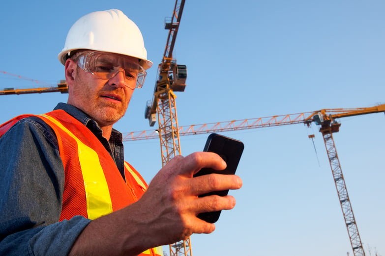 construction worker on his phone