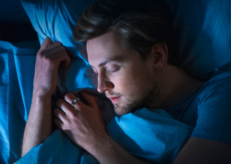 man sleeping with a smart ring on