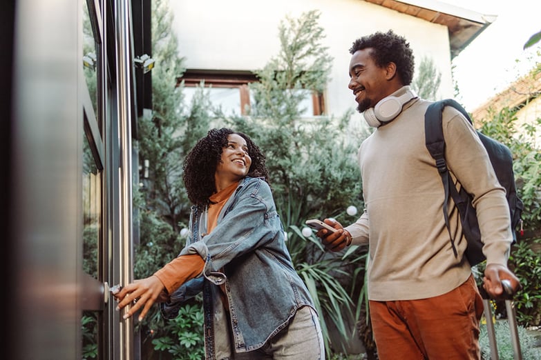 Tourists unlocking and entering the apartment