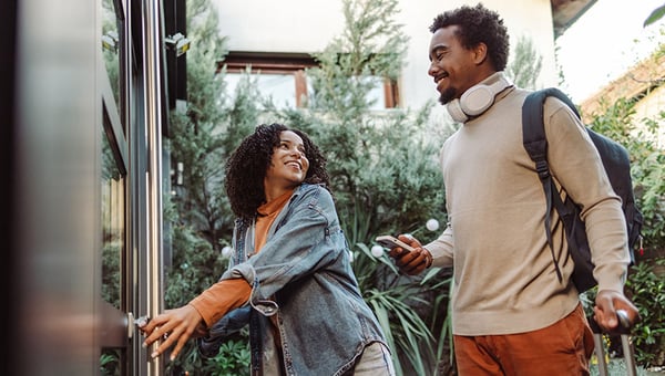 Tourists unlocking and entering the apartment 