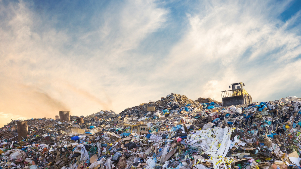 Garbage depository with wheel loader working