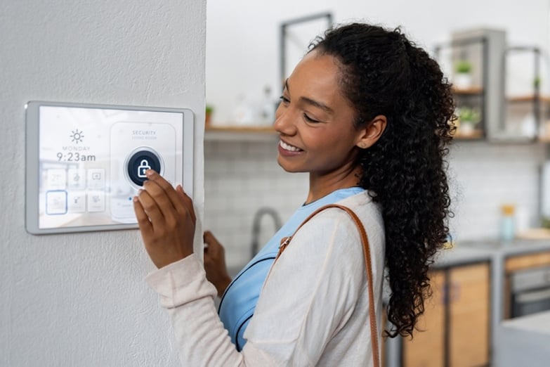 woman turning on/off smart home device