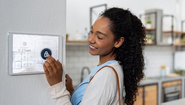 woman turning on smart home device 