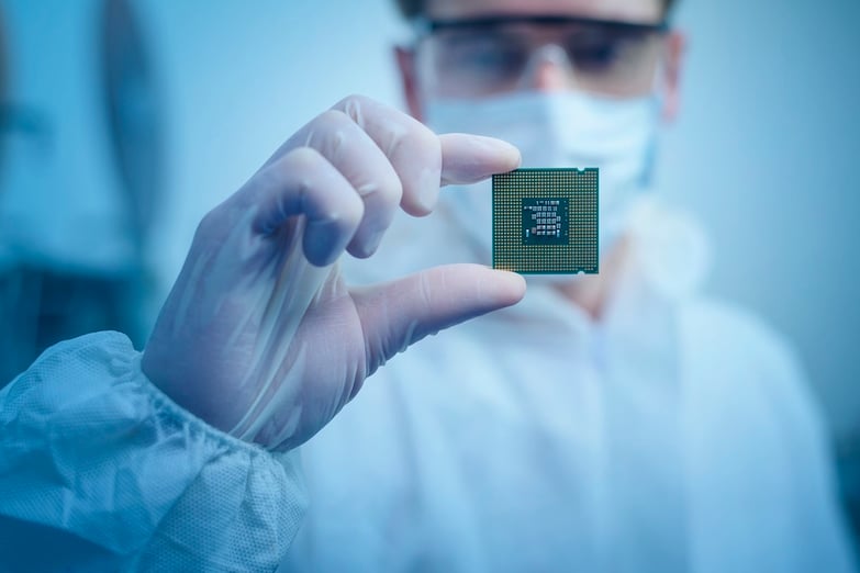 man holding computer chip